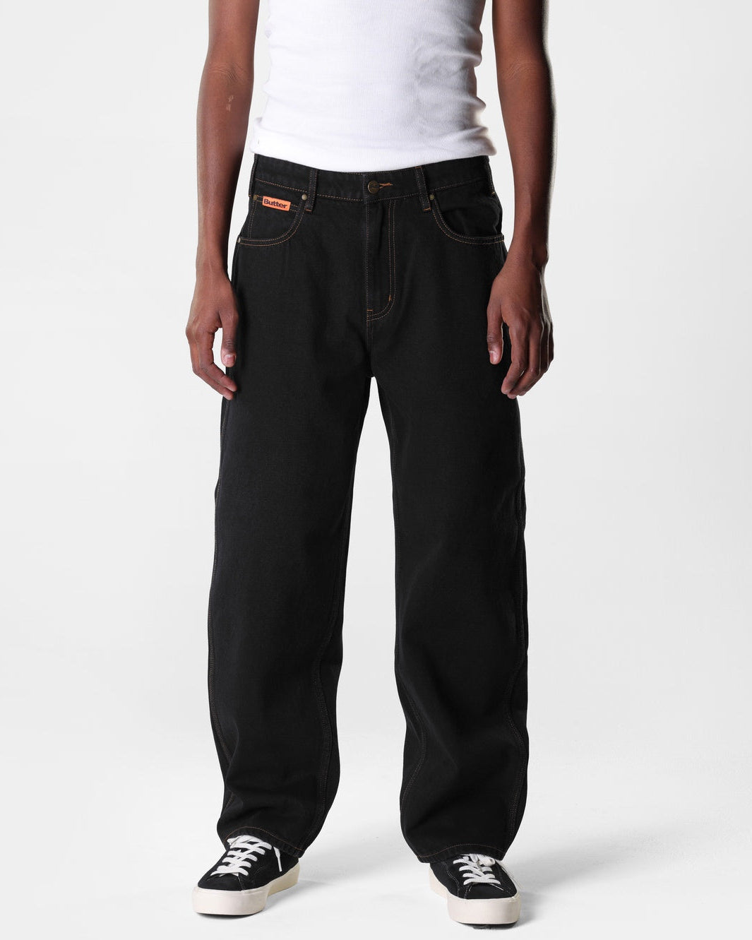 Washed black Butter Goods Relaxed skate jeans on a person