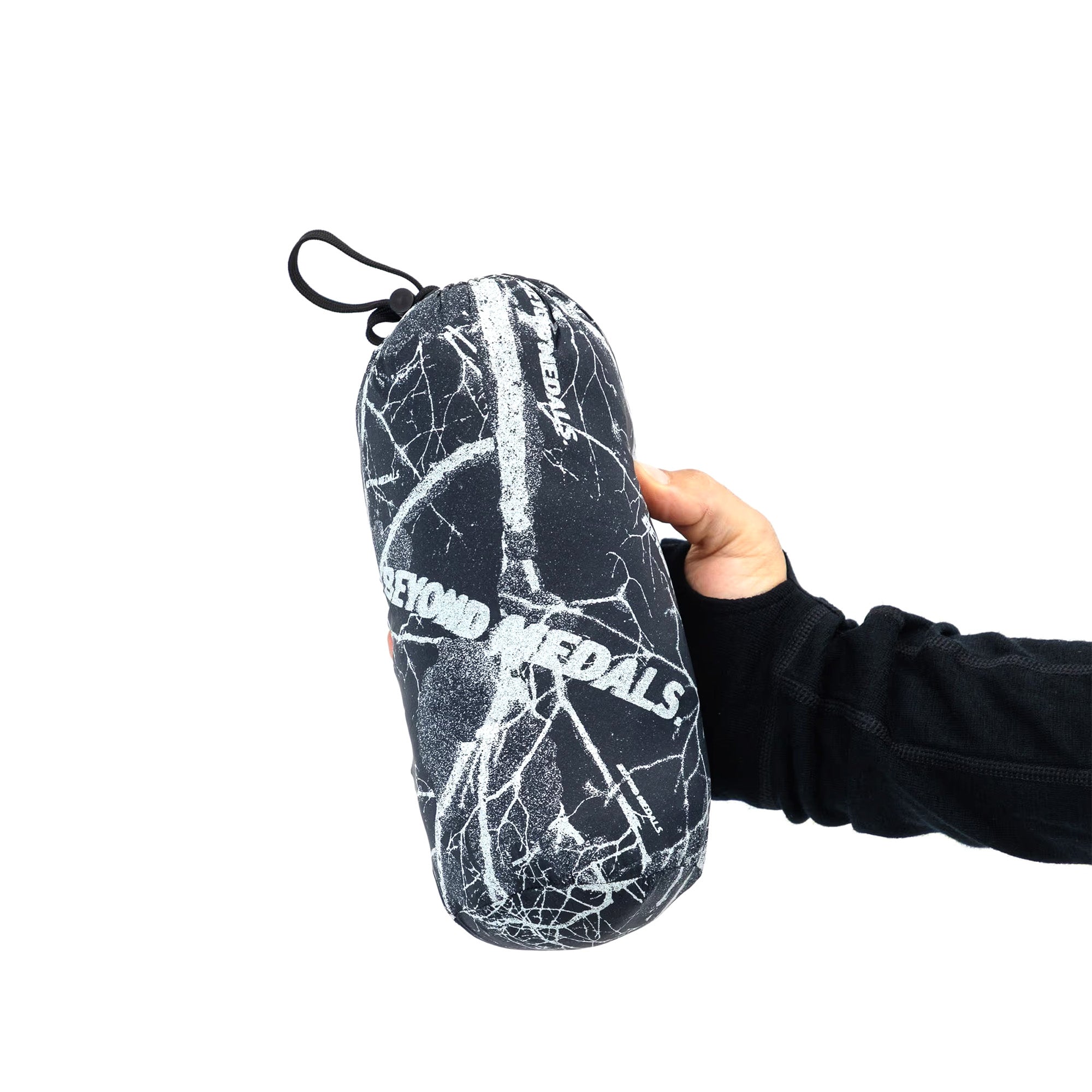 Black/blue Beyond Medals packable puffy vest packed up