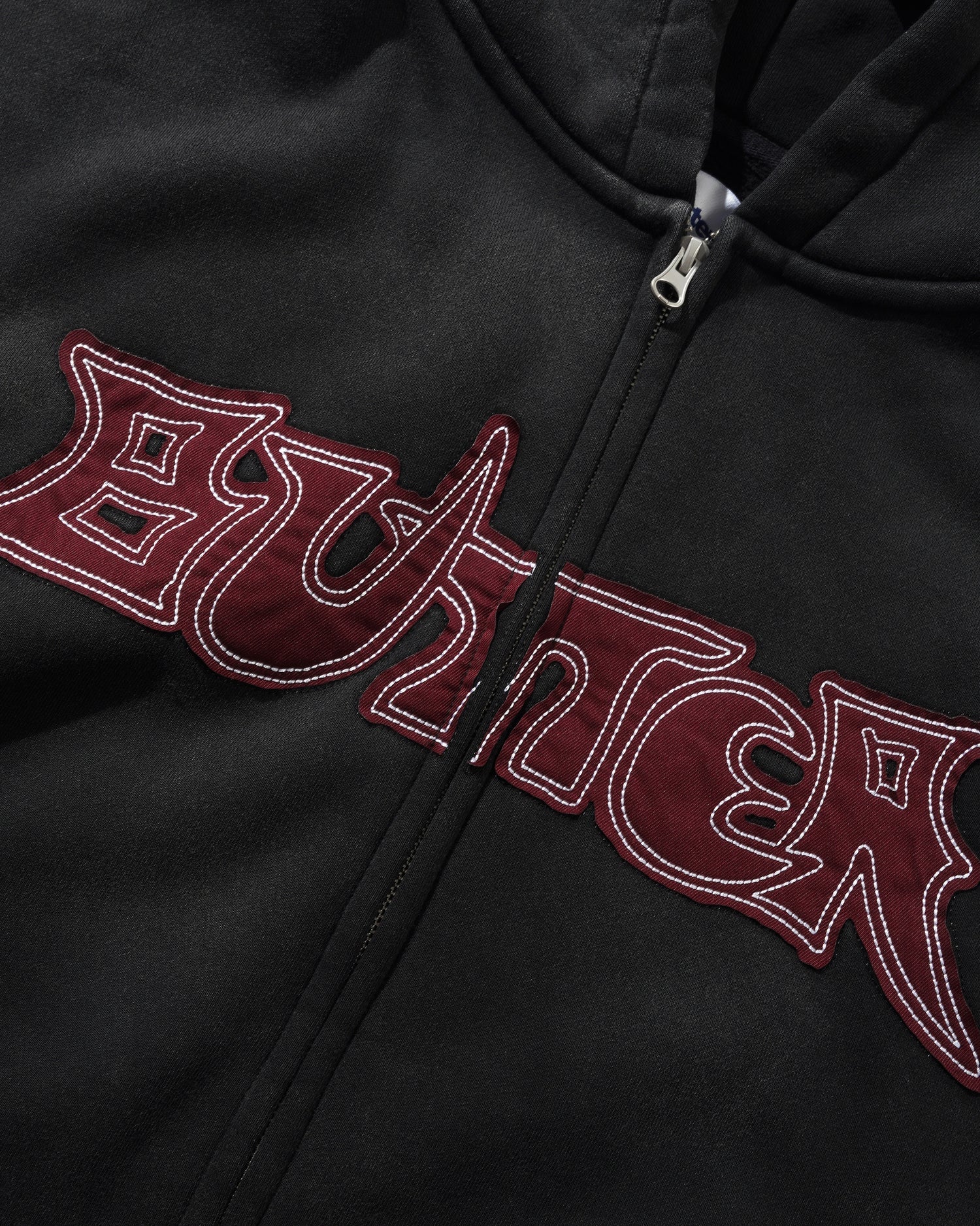Close up on black Butter Gioods zip up hoodie