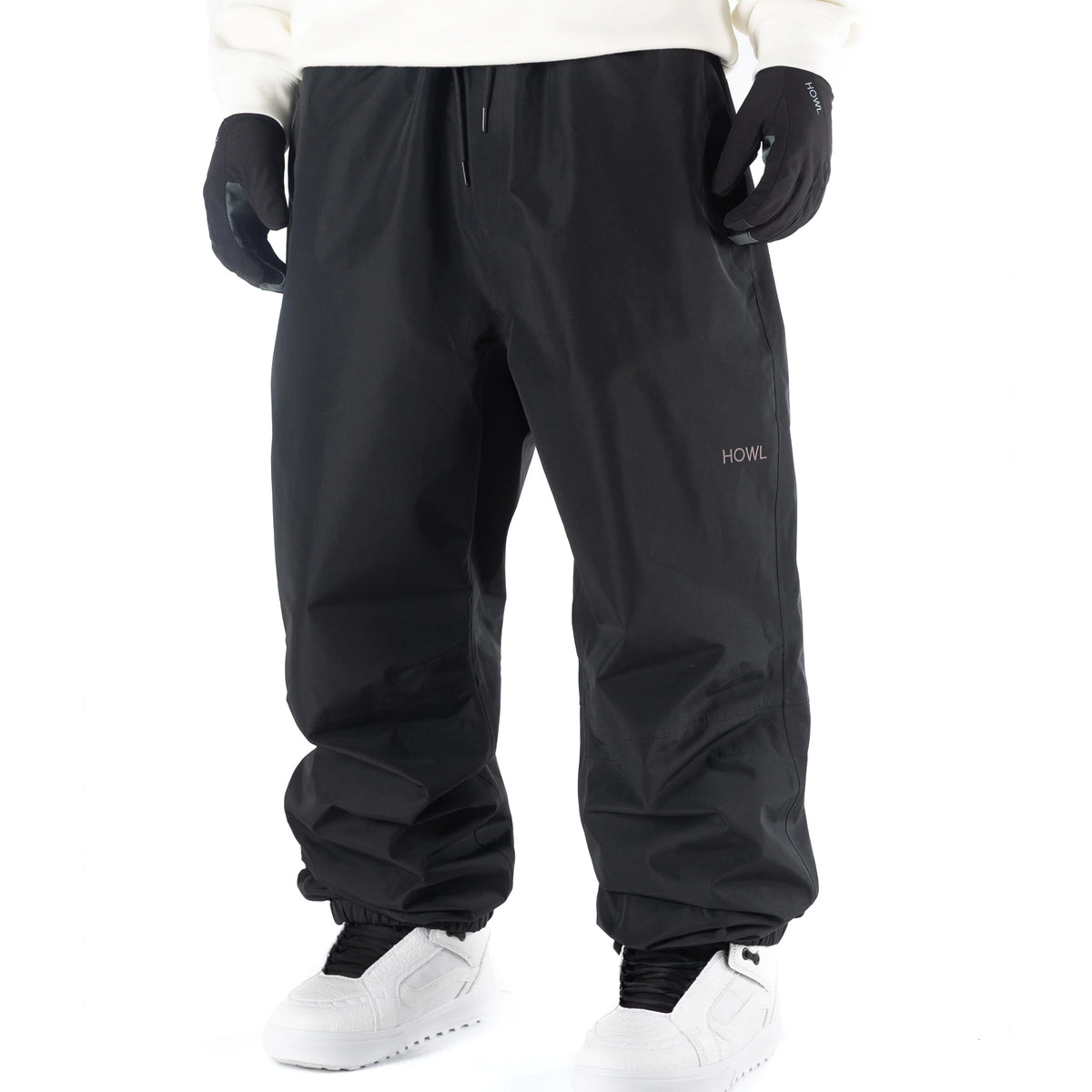 Black Howl Nowhere snowboard pant on mdel with a loose fit front view