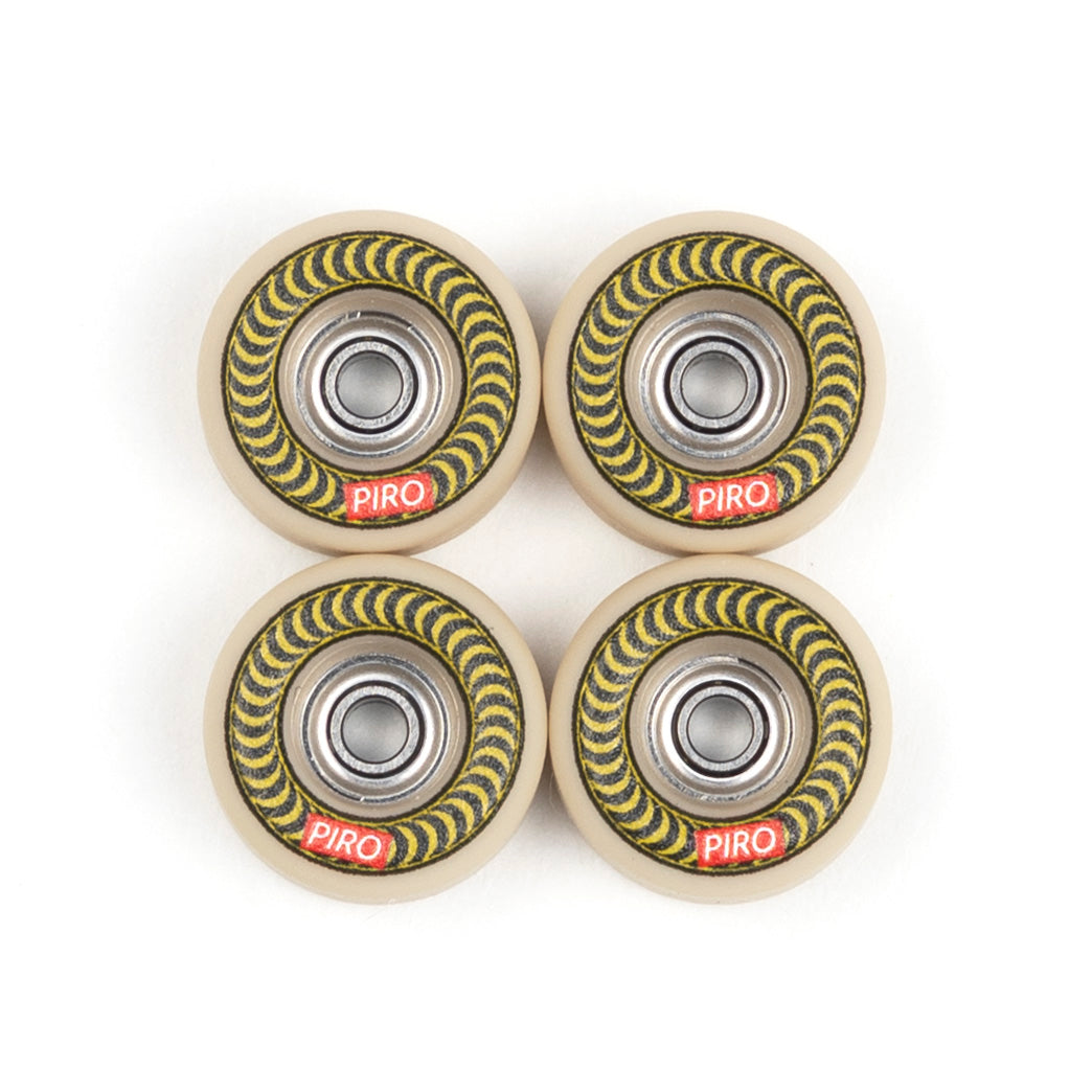 Tan Piro fingerboard wheels with a green spiral graphic