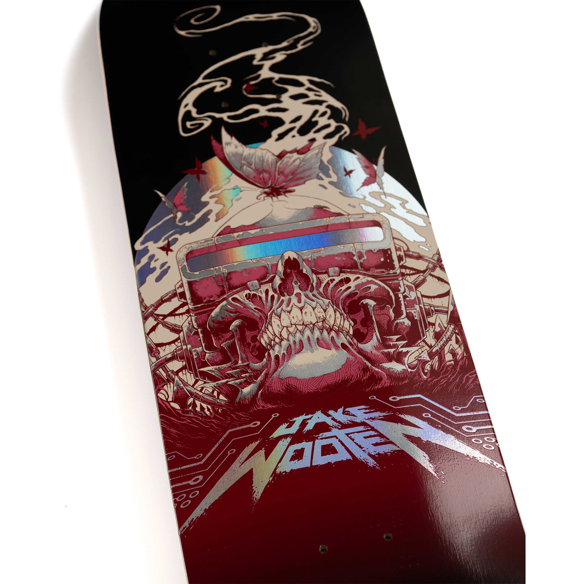 Santa Cruz VX 8.5 skateboard deck featuring a detailed graphic design with a skull, a cassette tape, circuit patterns, and the text 'Jake Wooer' at the bottom, photographed on a clean white background.
