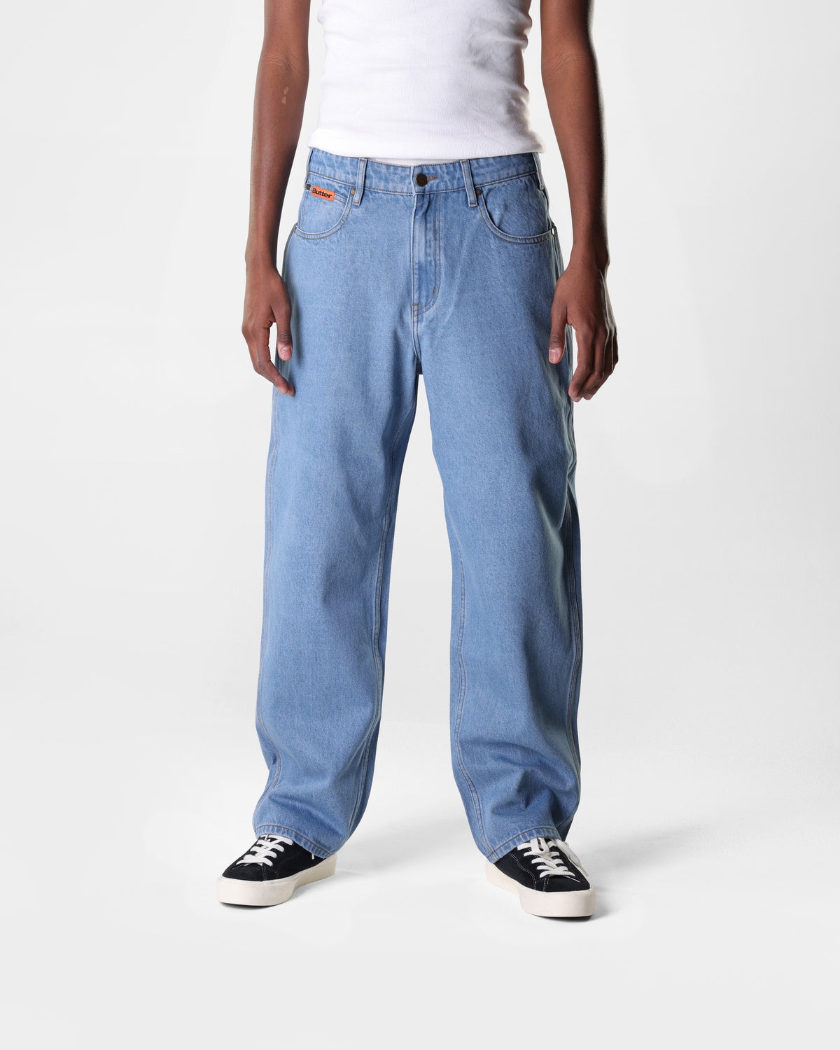 Washed Indigo blue Butter Goods Relaxed skate jeans on a person