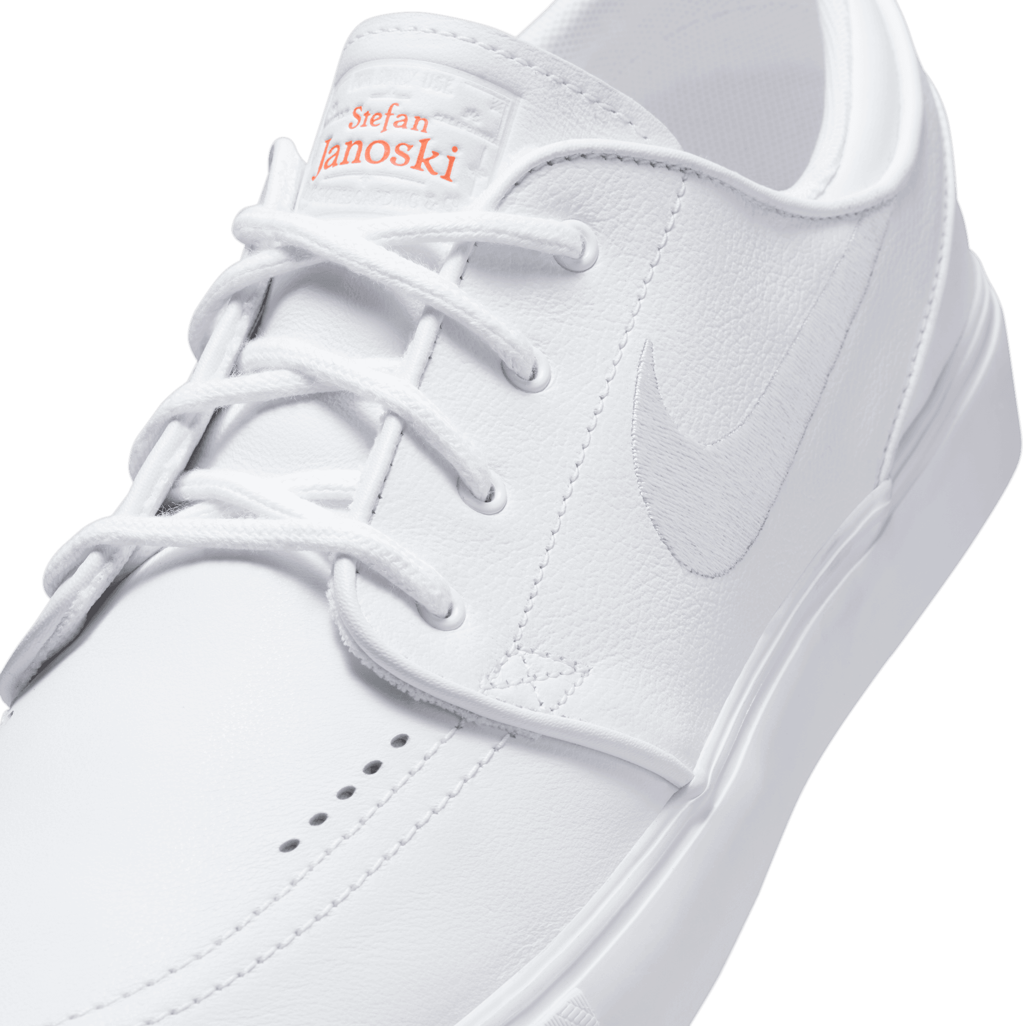 Nike sb janoski white and orange best sale