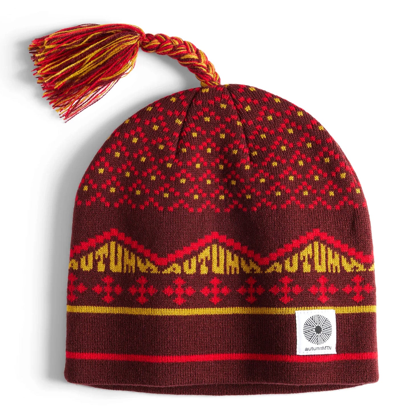 Burgundy Autum headwear beanie with a tassle
