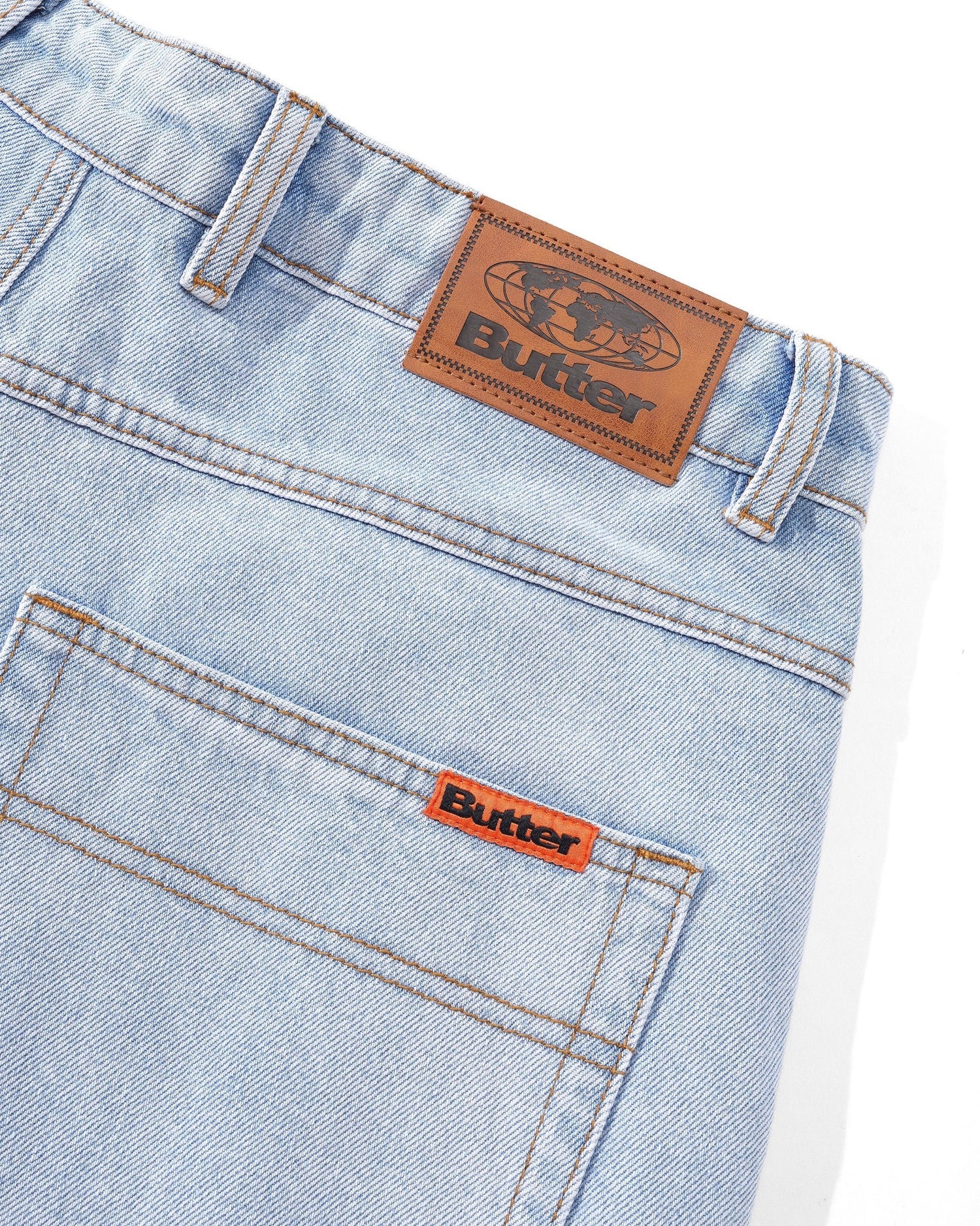 Light blue Butter Goods baggy skate jeans with leather patch