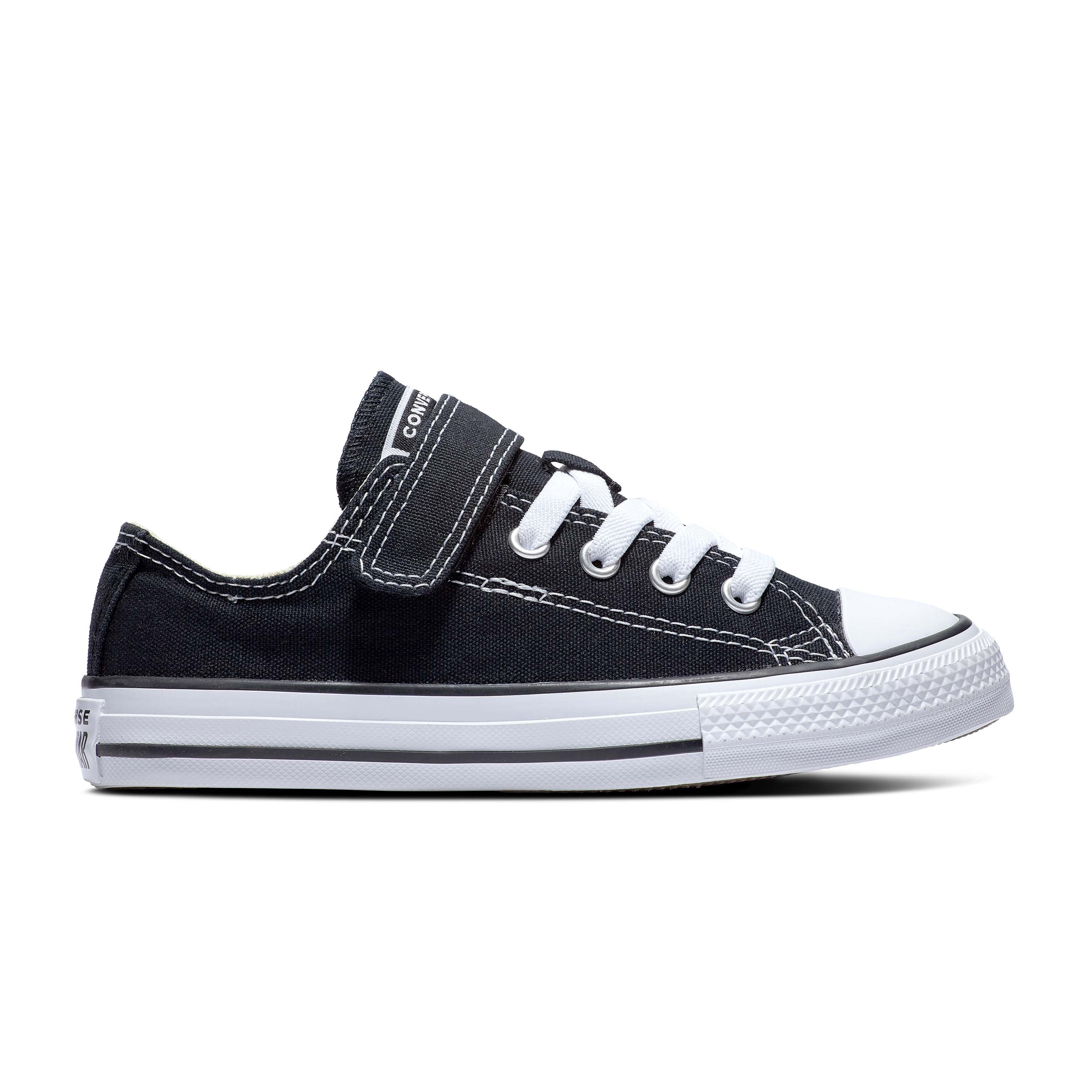 Black and white kids Converse shoe with white elastic laces and black Velcro strap