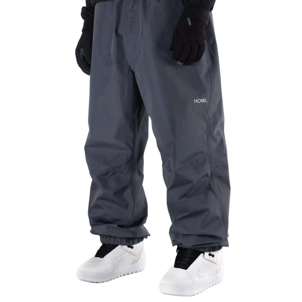 Dark grey Howl snowboard pants on model with a loose fit front view