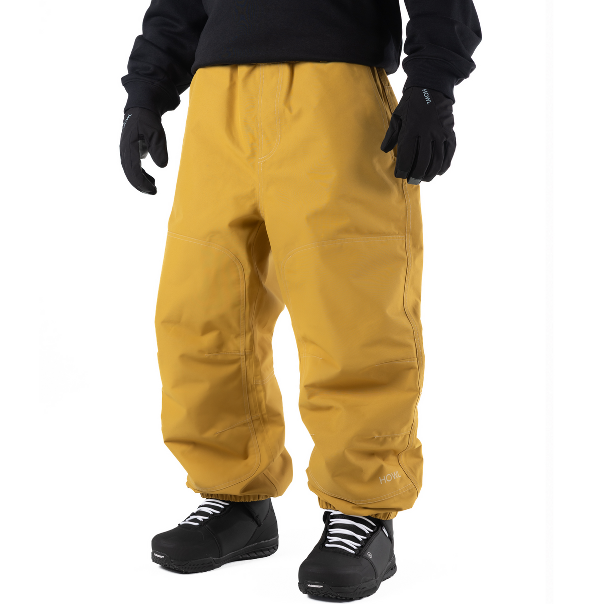 Yellow Howl workwear snowbaord pants with a loose fit on person