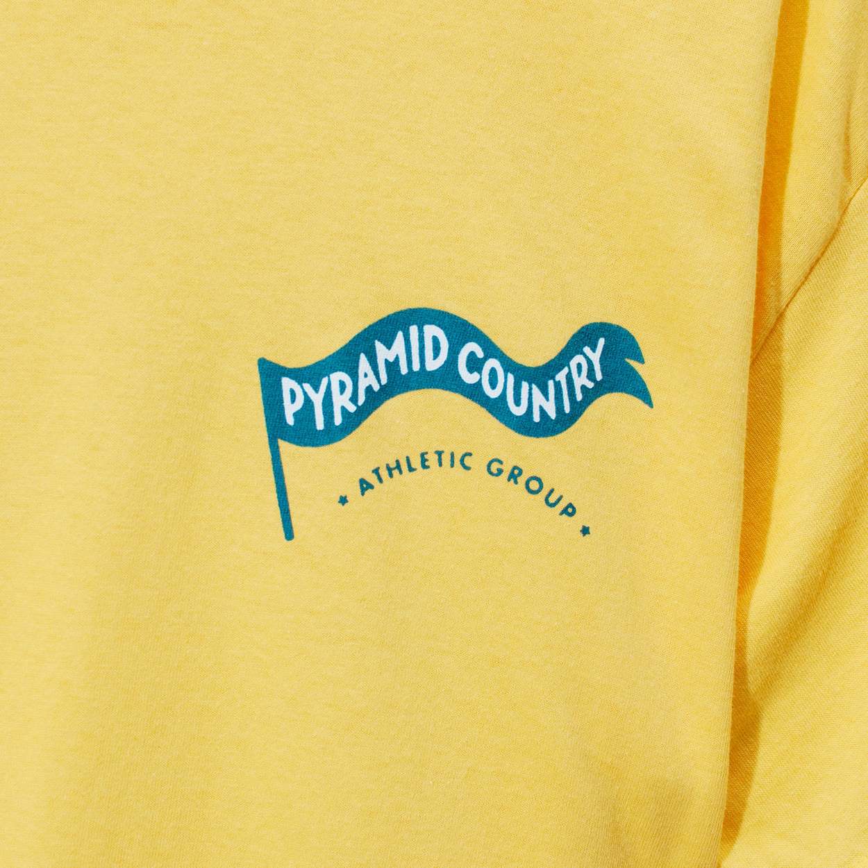 Pyramid Country Athletic Group Tee - Yellow